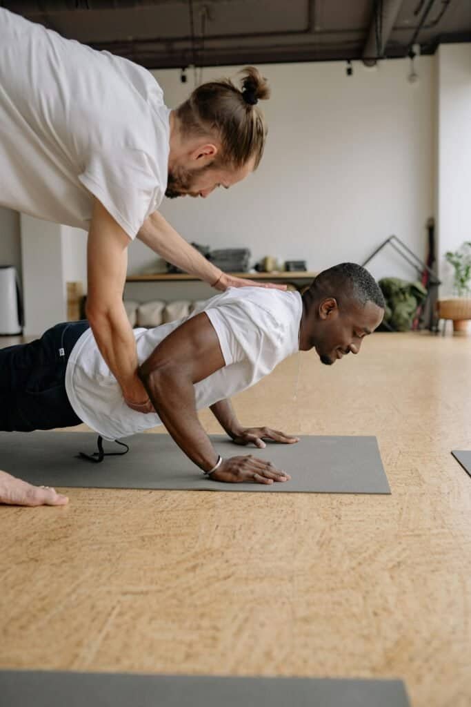 Home workout plan with partner-assisted push-ups for better muscle engagement